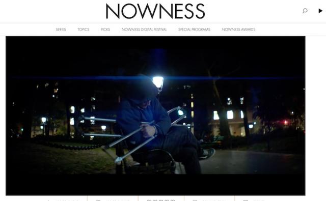 image of bill shannon on. a bench at night wiht his crutches folded over his lap